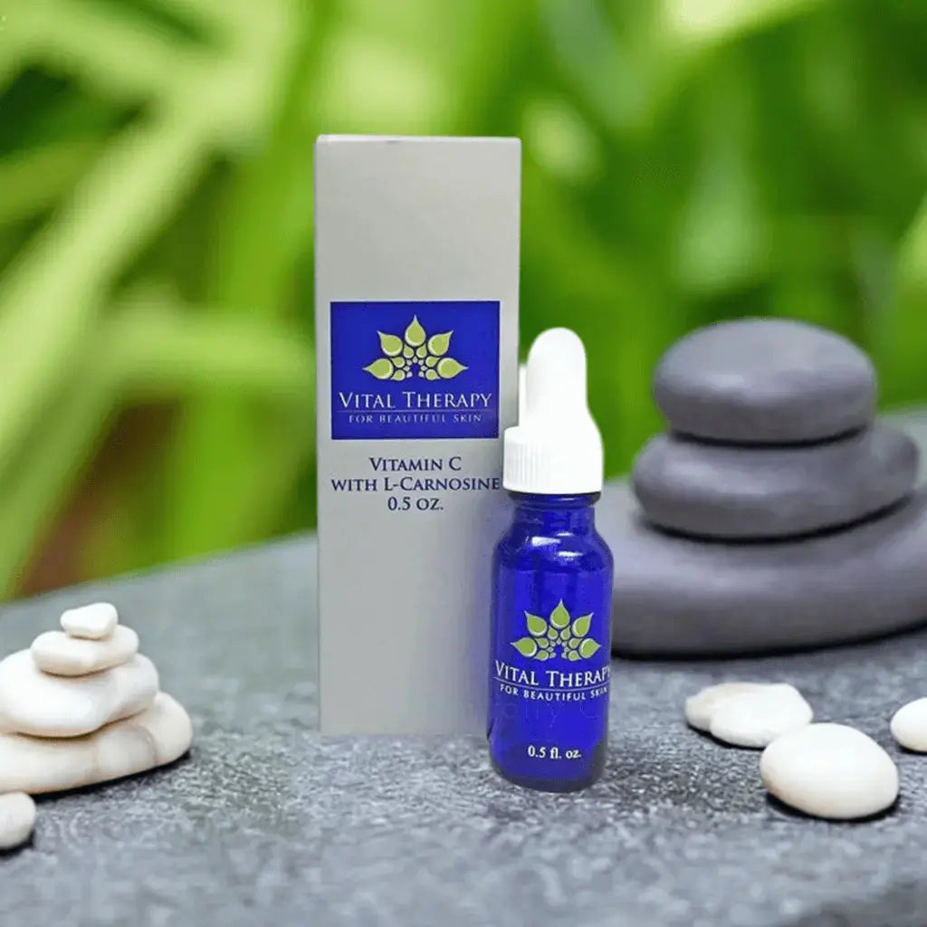 Vitamin C Serum with Caffeine and L-Carnosine 0.5 oz bottle, skincare product in natural stone setting.